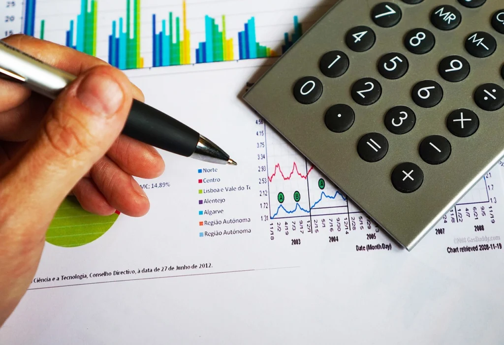 Calculator and financial graph on desk for ARR calculation